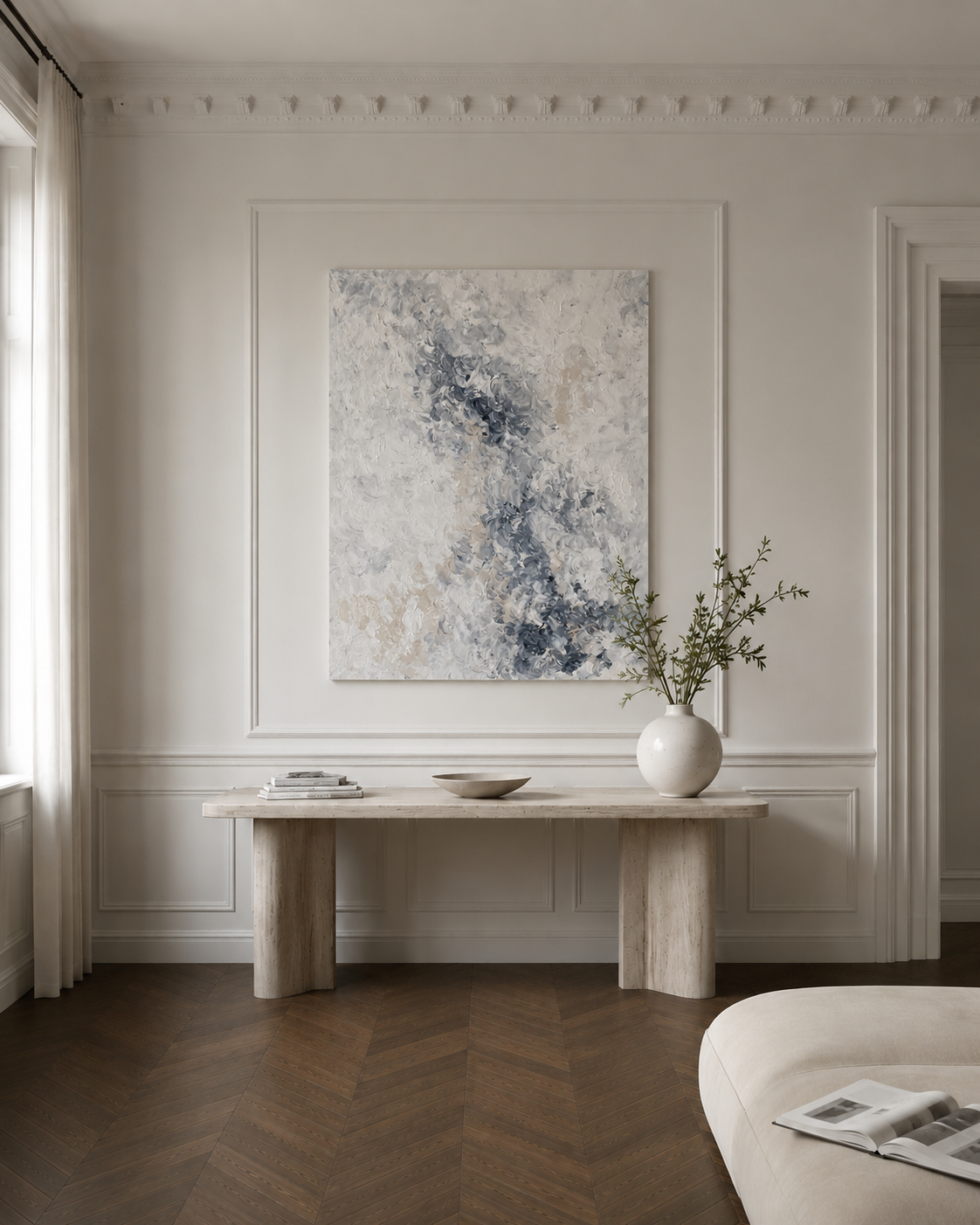 Modern interior with abstract painting, marble table, and vase on a wall.