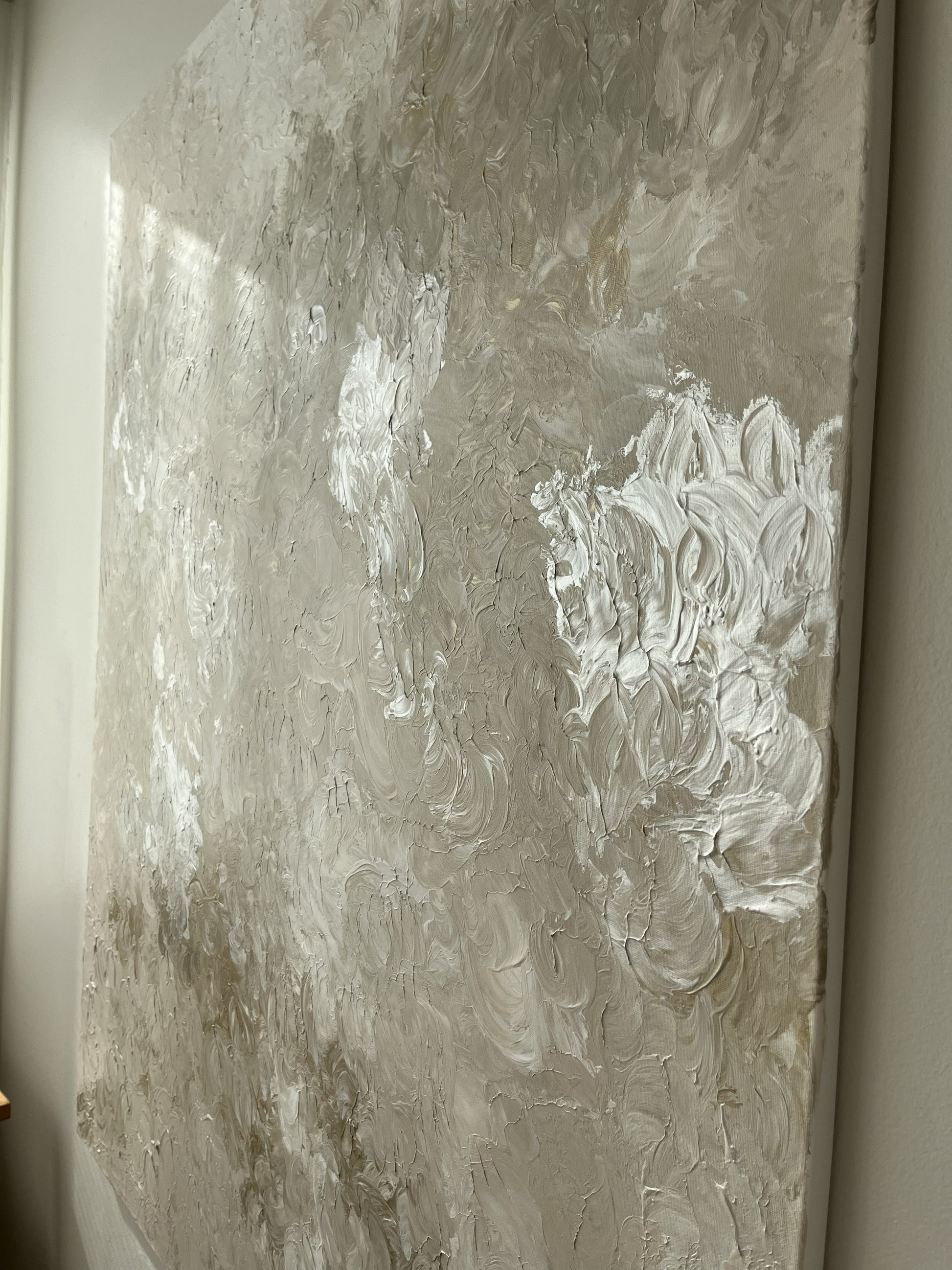 Abstract painting with textured brushstrokes on a neutral background