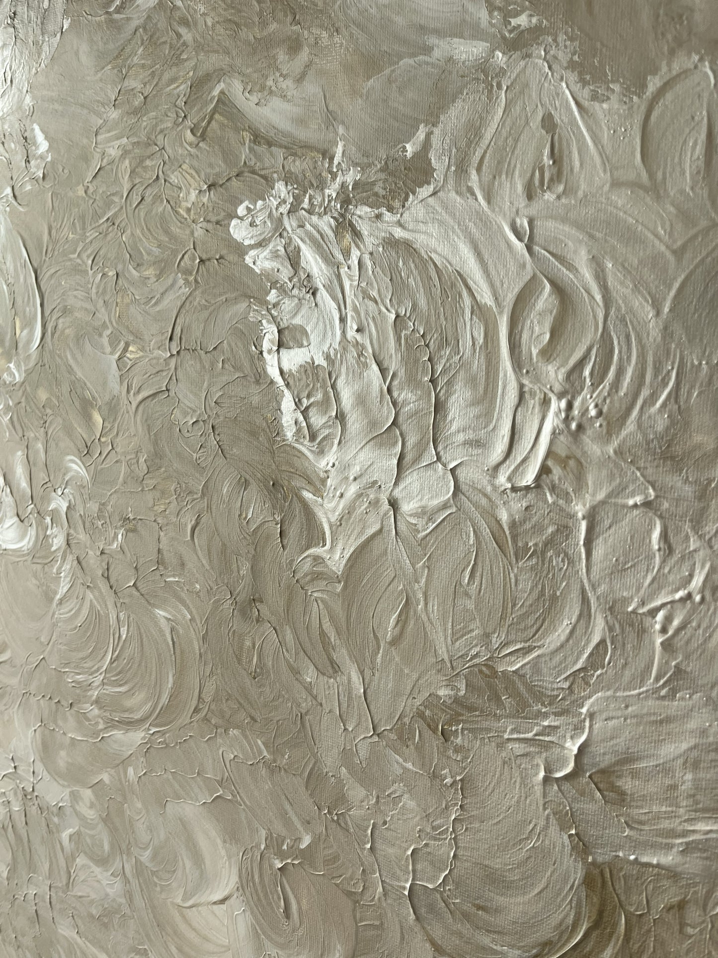 Textured beige surface with artistic brush strokes