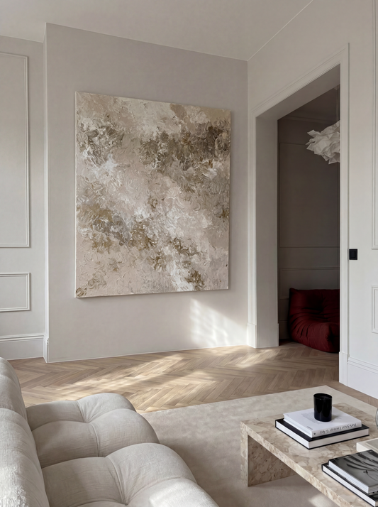 Modern living room with abstract art on the wall and a sofa.